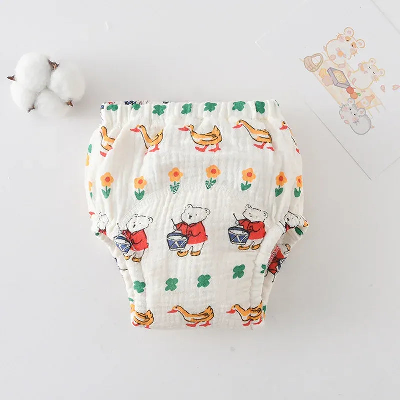 Baby care cotton training diaper with cute bear and duck pattern on white background for toddlers.
