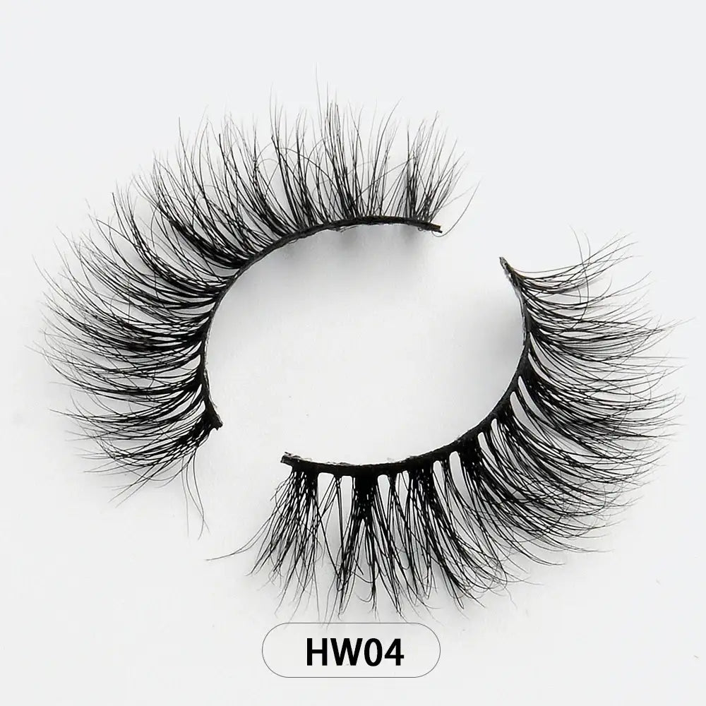 Black 3D mink false eyelashes with a wispy, layered design on a thin flexible band. Label reads HW04.