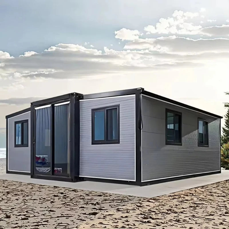 Gray and black modular container house with sliding glass door and front windows