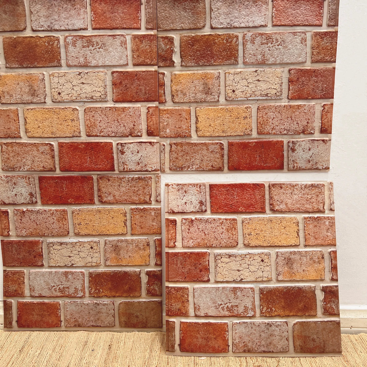 Peel-and-stick brick backsplash tiles, multicolor red and cream textured pattern