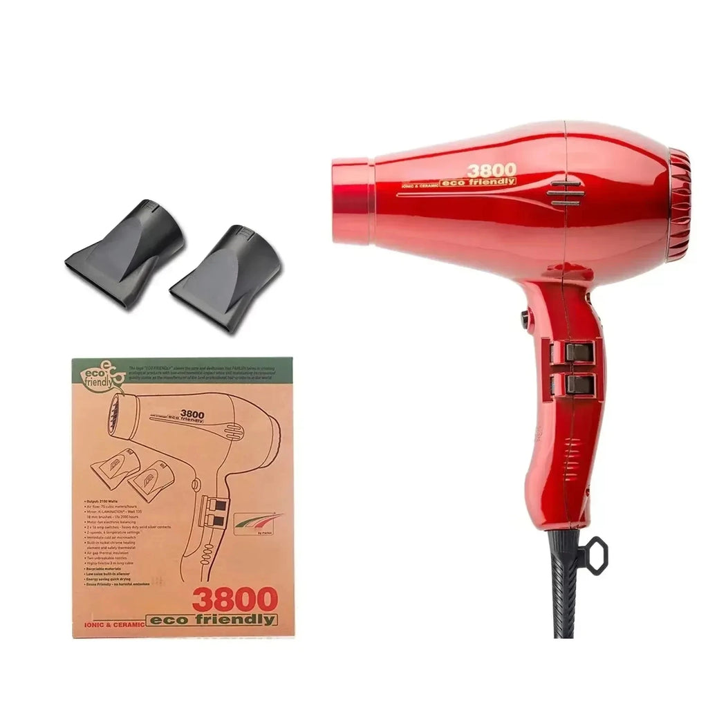 Red 2100W ionic hair dryer with two concentrator nozzles and manual, featuring 3-speed settings for professional styling.