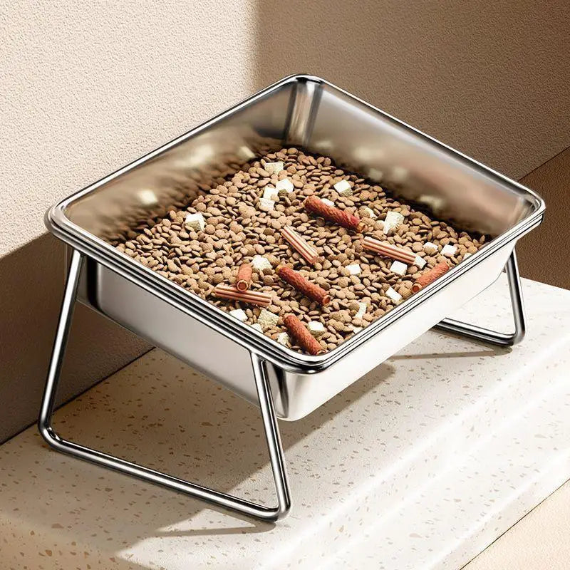 Slanted stainless steel elevated pet bowl for cats and dogs, designed for comfortable feeding and neck protection.