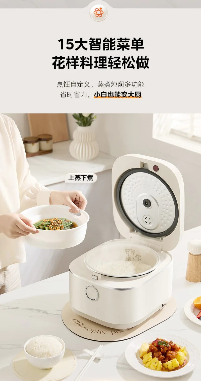 White rice cooker on countertop with lid open and bowls of cooked dishes nearby