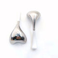 Two heart-shaped, silver stainless steel cryo massage sticks with white handles on a white background.