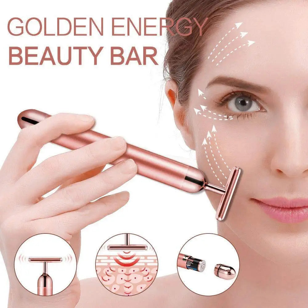 Rose gold electric T-shaped vibrating face massager bar being used on a woman's cheek with diagrams of skin vibration.
