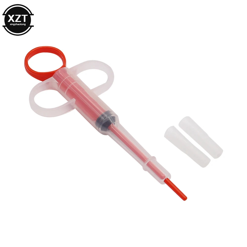 Red and clear plastic pet pill gun syringe for easy medicine, tablet, and water feeding for dogs and cats.