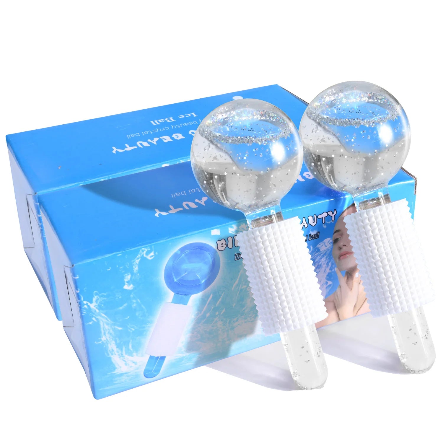 Two glass facial ice globes with silver glitter and white textured silicone grips, displayed with their blue retail box.