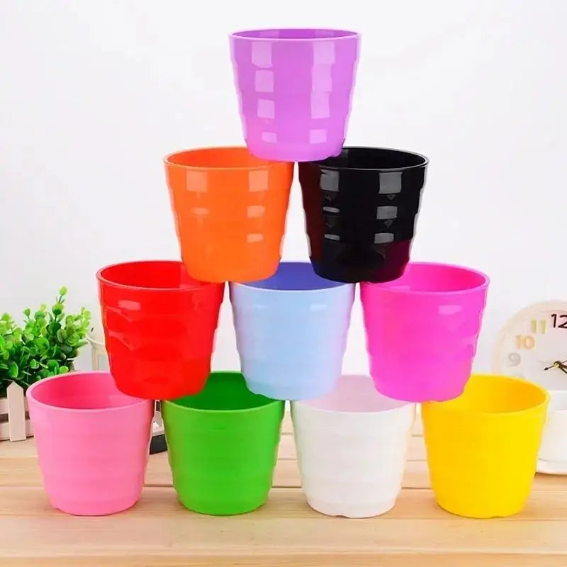 Colorful plastic flower pots with saucers, assorted colors for succulents