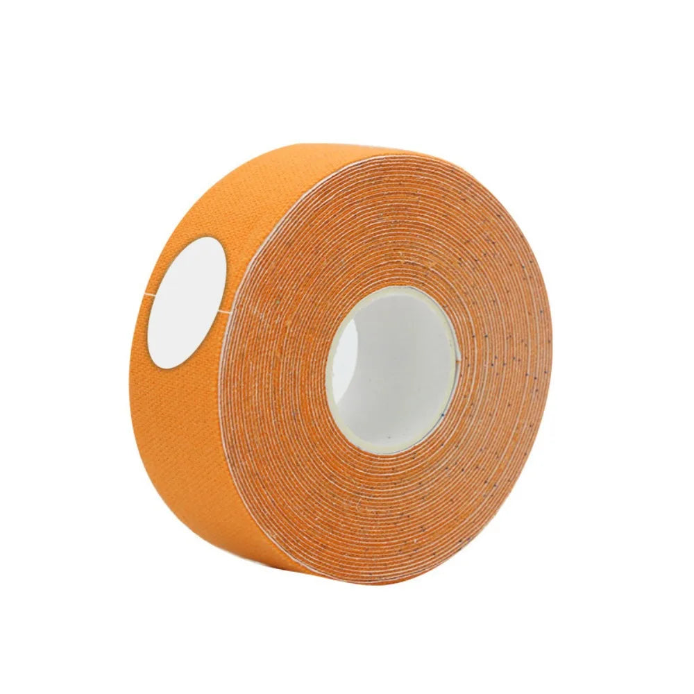 A roll of bright orange fabric-textured face lifting tape on a white plastic core.