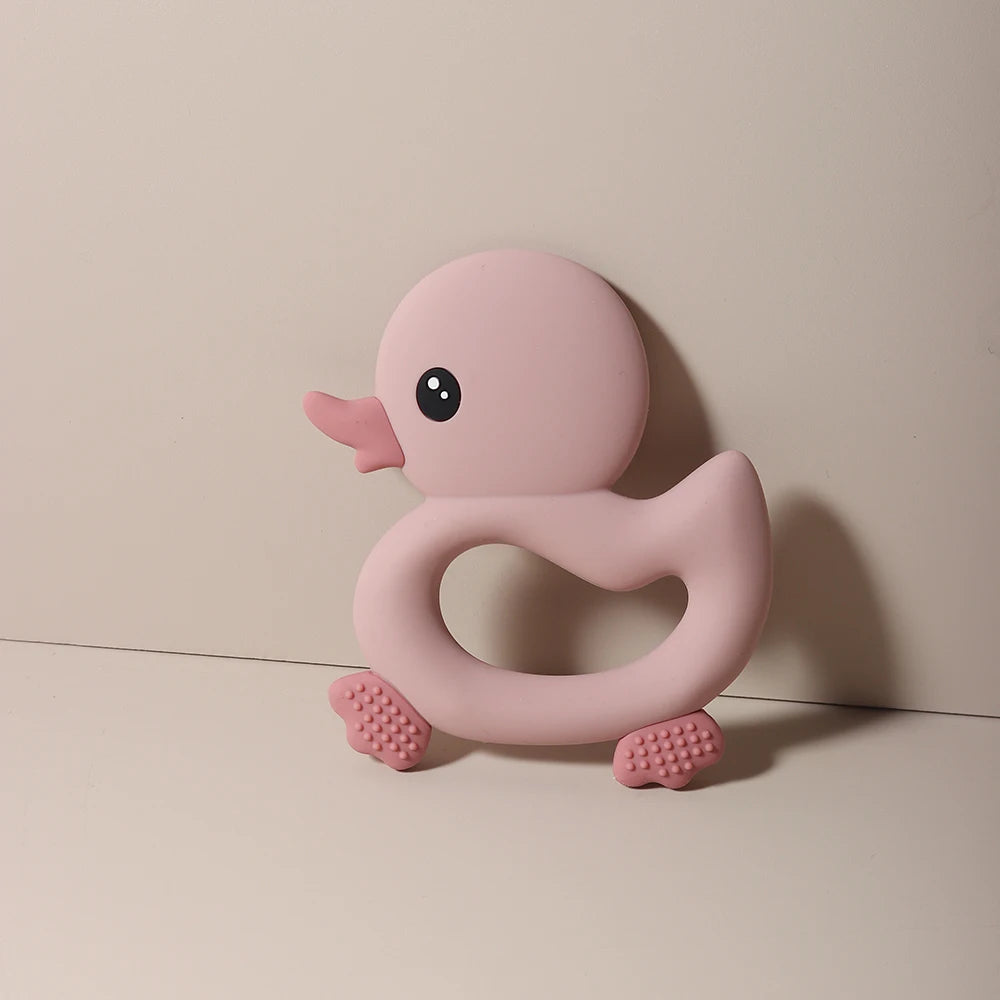 Pink silicone duck teething toy for baby pain relief.