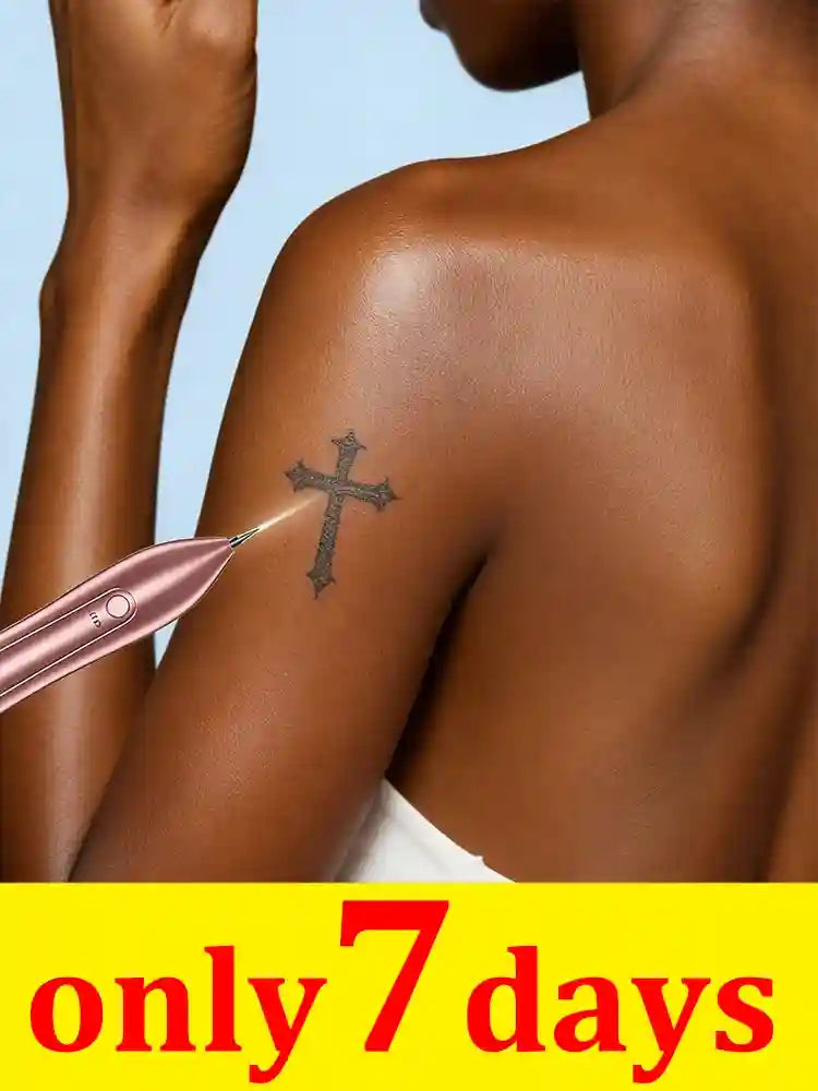 Rose gold handheld laser tattoo removal pen treating a cross tattoo on a person's shoulder, home skincare device.