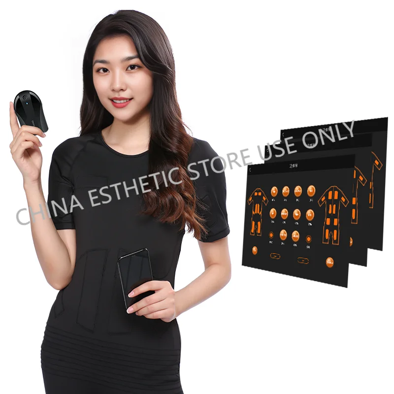 Woman wearing black wireless EMS fitness muscle training suit with remote controller and app control interface display.