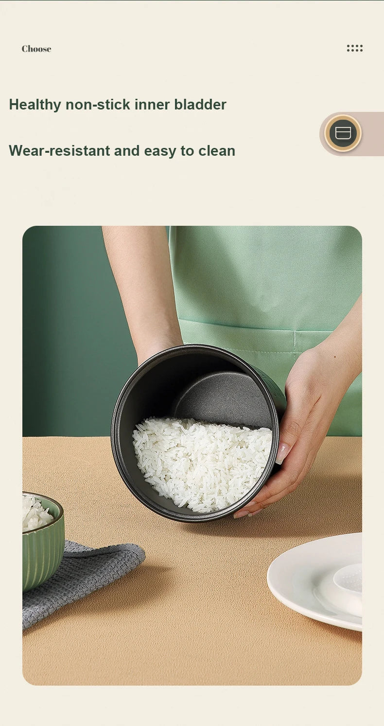 Mini electric rice cooker with removable non-stick inner pot holding cooked rice