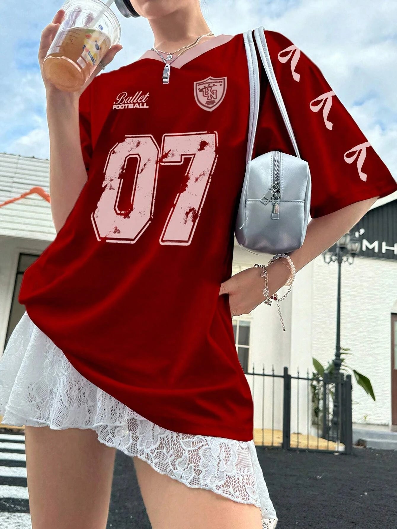 Tidesmit red V-neck oversized football jersey with white 07 print and ribbon graphic details on the sleeve.