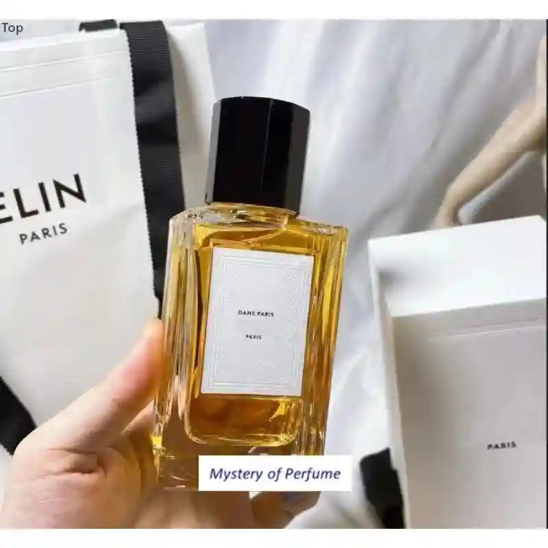 Celine Dans Paris unisex perfume: square glass bottle with black cap, amber EDP fragrance in luxury white gift box.