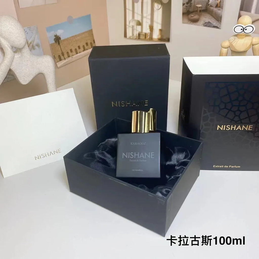 Nishane Karagoz 100ml Extrait de Parfum for men. Square black bottle with gold cap in luxury presentation gift box.