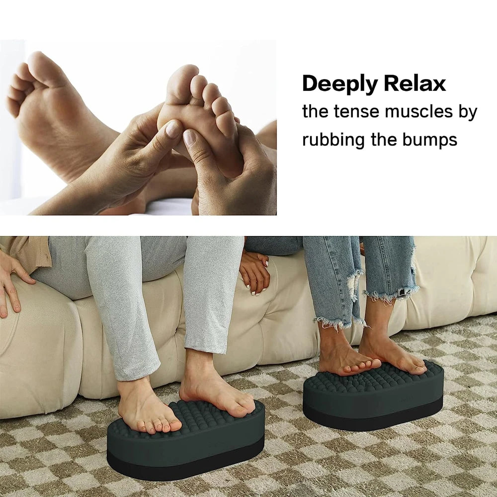 Grey silicone foot rest stool with textured massage bumps for plantar fasciitis relief under desk or in home office.