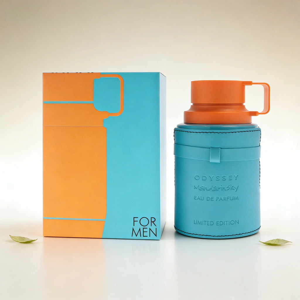 Odyssey Mandarinsky men's eau de parfum in a cylindrical turquoise leather bottle with an orange lid and matching box.