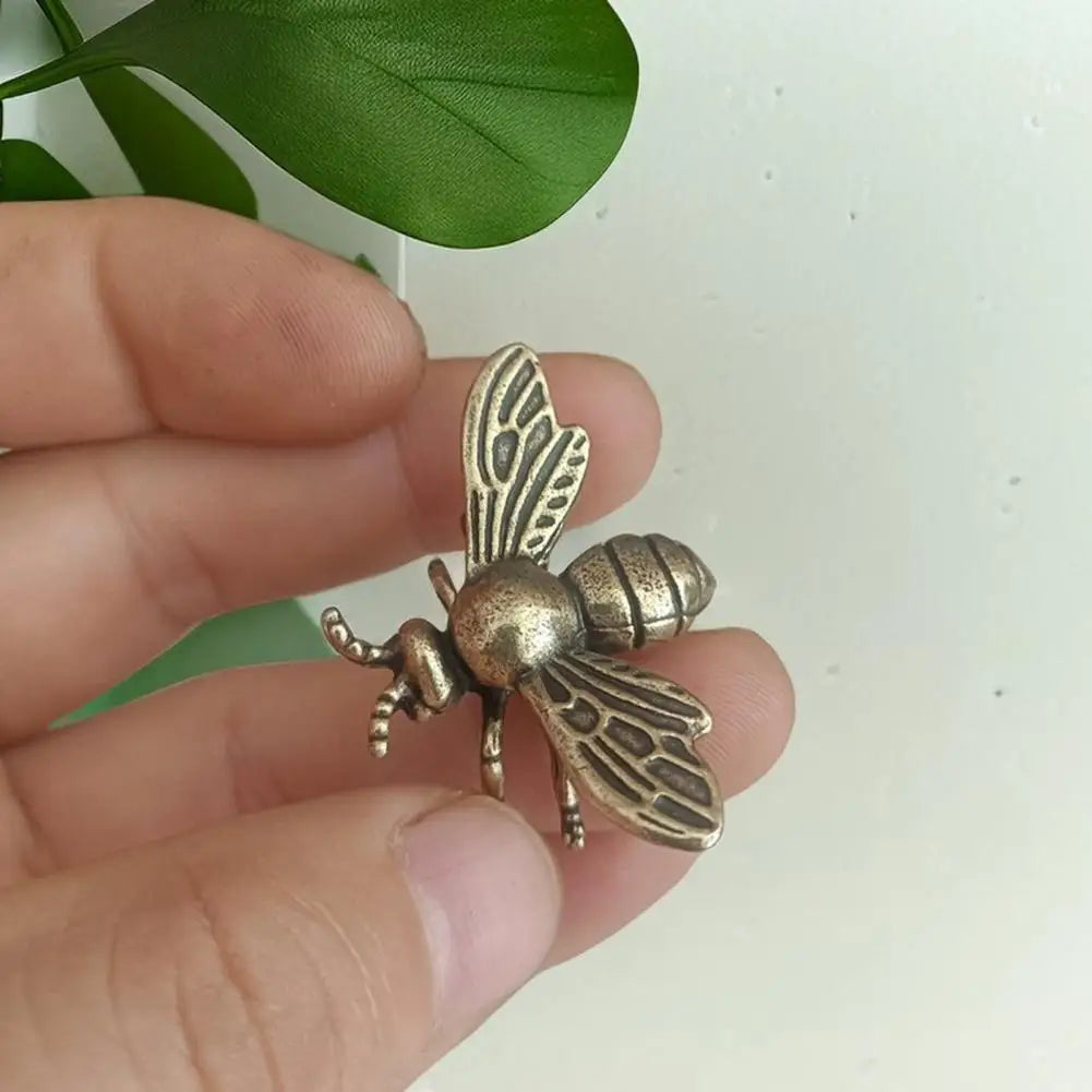 Solid brass bee tea pet figurine, a detailed golden metal sculpture for desk decor and tea ceremonies.