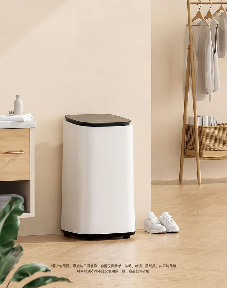 Tidesmit 60L automatic household clothes dryer with baby disinfection and air-drying features, side angle view.