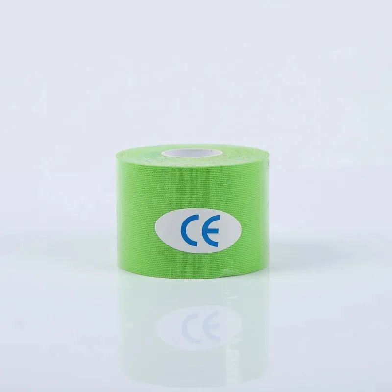 A roll of bright green cotton face-lifting tape with a white CE certification label on a reflective white surface.