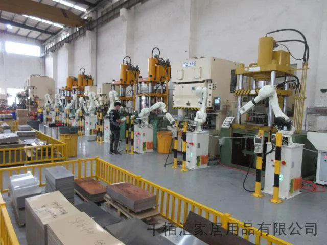 Stainless steel pressure cooker manufacturing workshop with multiple automated stations