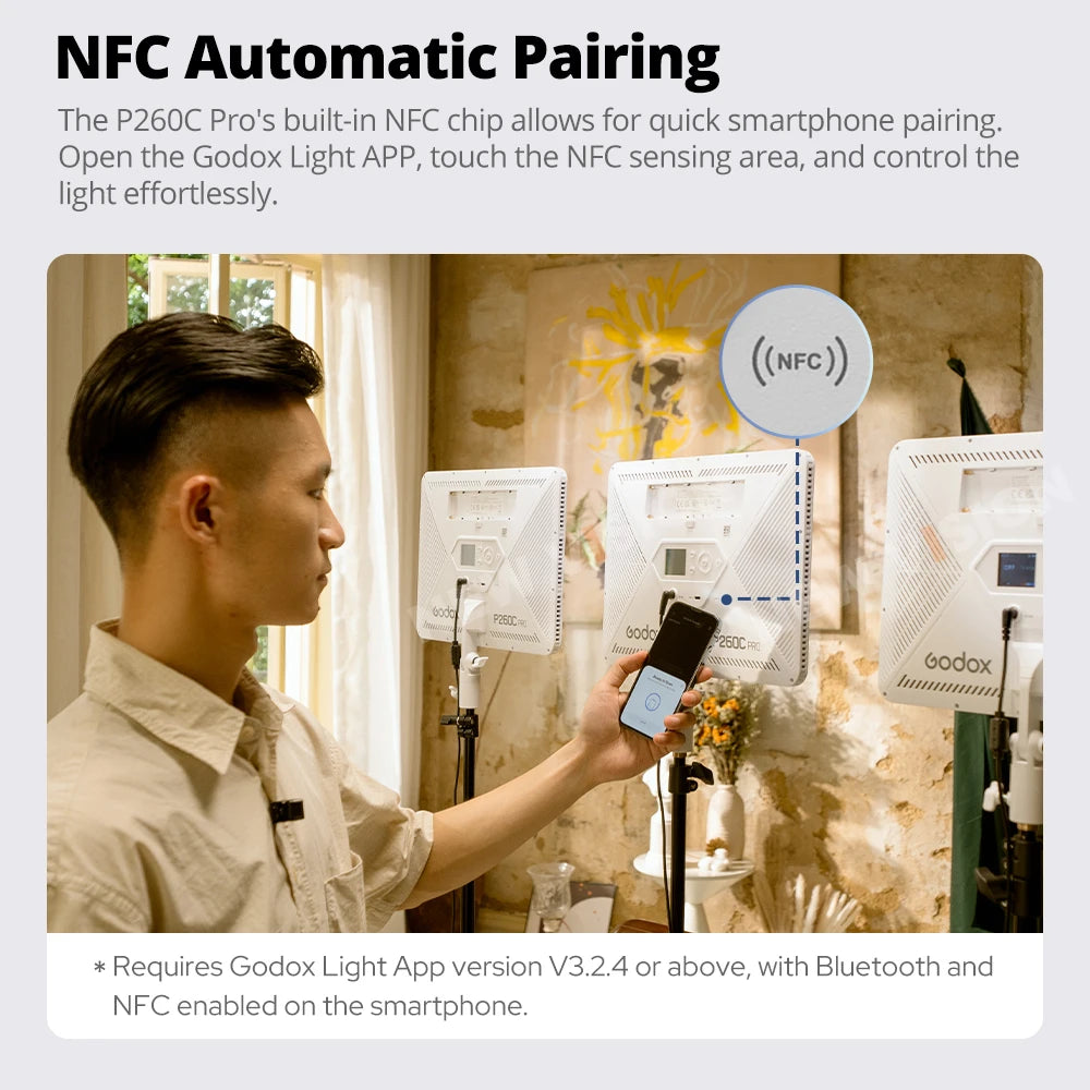 A person uses a smartphone to NFC pair with a square, white P260C Pro LED light panel on a stand.