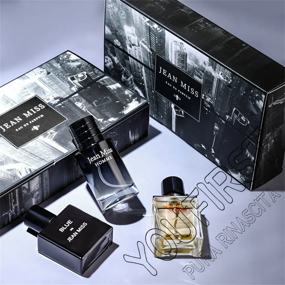 Jean Miss 3pc Men’s Eau de Parfum gift set with square glass bottles and black city-themed boxes. Masculine cologne.
