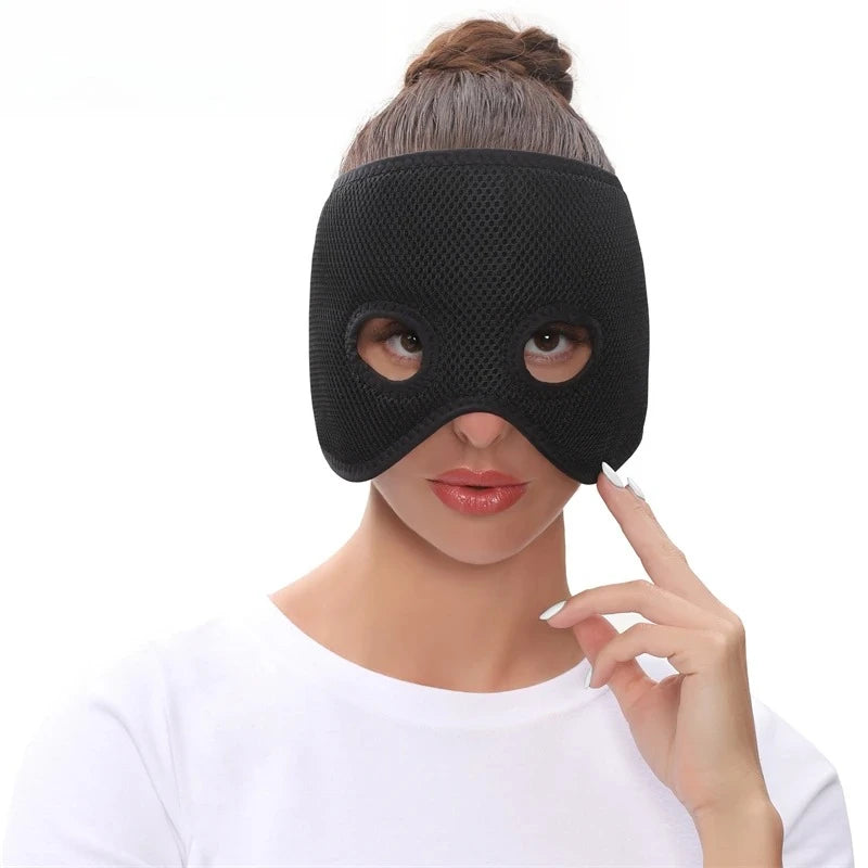 A woman wearing a black, air-layered, mesh fabric heating half-face mask with circular eye cutouts.