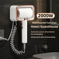 White and rose gold wall-mounted 2000W hair dryer with coiled cord for home bathrooms and hotels.