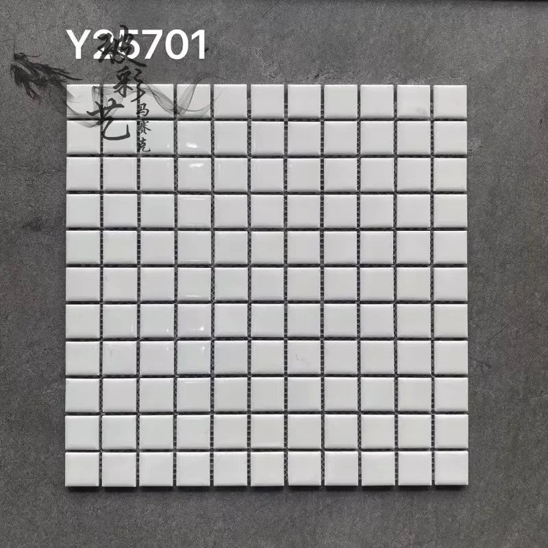Ceramic mosaic tile sheet with small square white tiles on grid backing