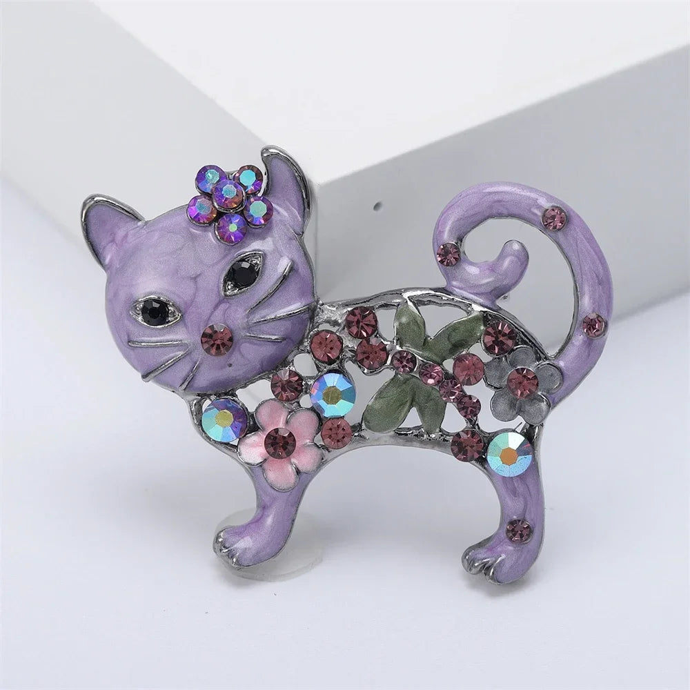 Sparkling purple enamel cat brooch with floral crystals, perfect as a unique gift for cat lovers.