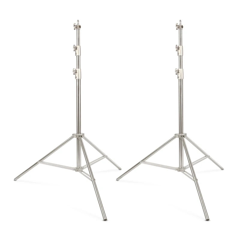 Two silver stainless steel light stands with adjustable telescoping columns and tripod bases for photography lighting.