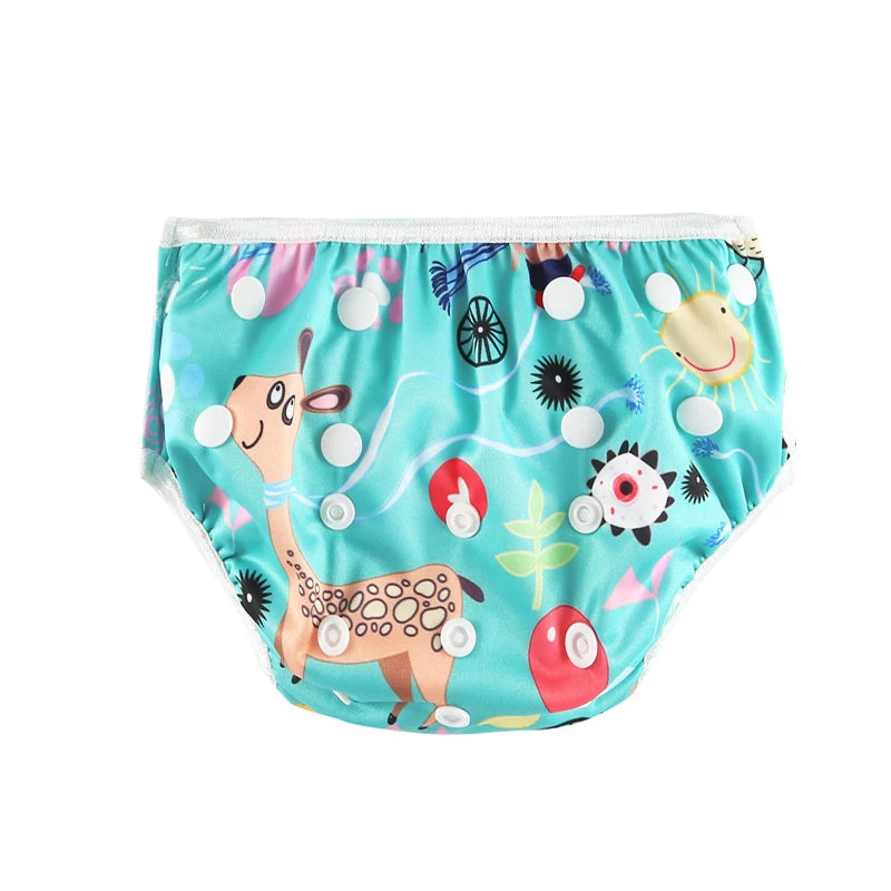 Reusable cloth baby diaper with adjustable snaps and cute giraffe print design on a turquoise background.