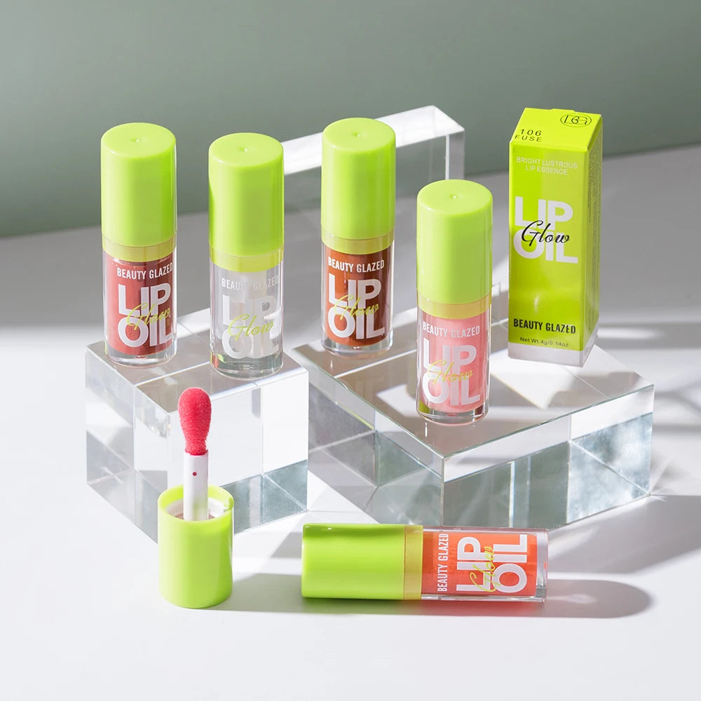Beauty Glazed moisturizing lip oil set: pearlescent mirror-finish lip stain tubes in various shades with applicator.