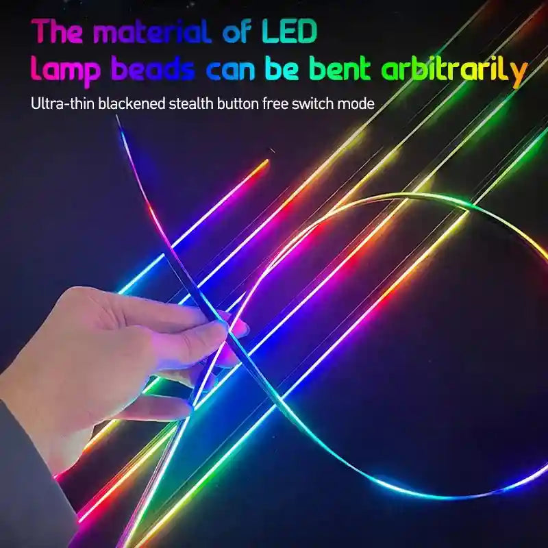 Flexible, ultra-thin LED light strip displaying a multi-colored gradient, held by hand to show bendability.