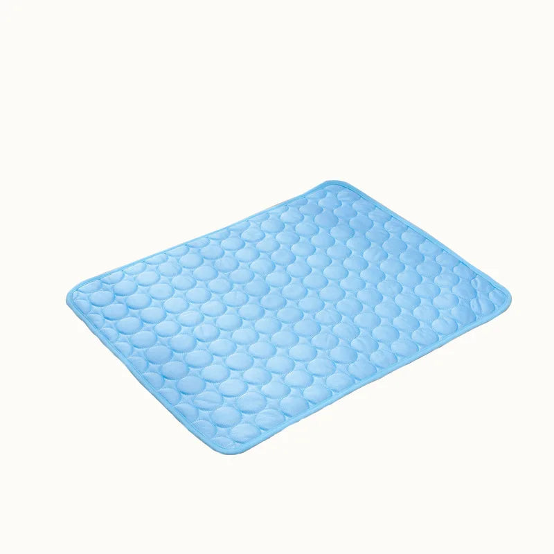 Blue pet cooling mat with embossed bubble texture, square shape on a light background.