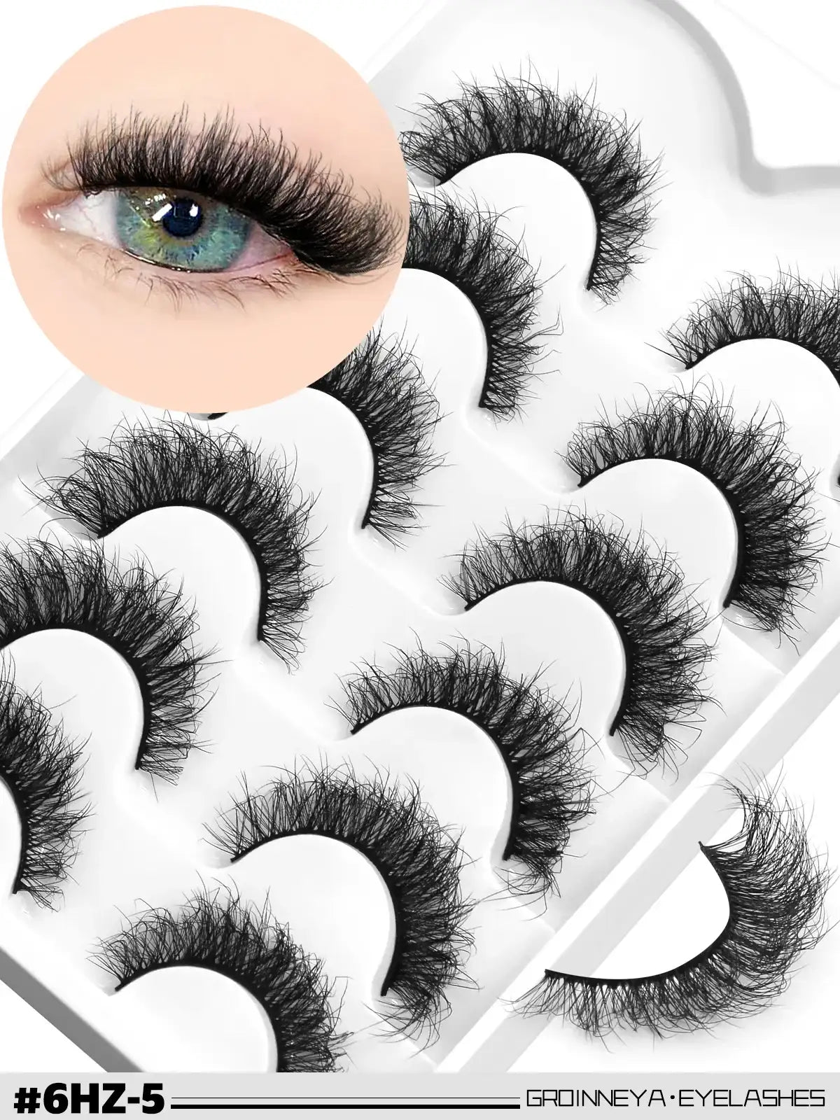 Pack of 10 black, fluffy 3D mink false lashes with a wispy, cat-eye style, shown in a white tray with an eye insert.