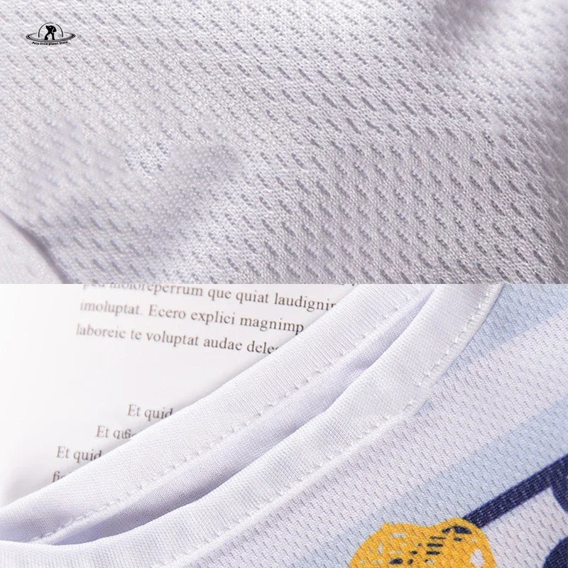 Close-up of breathable white mesh summer vest for small dogs and cats. Lightweight cartoon print pet apparel.