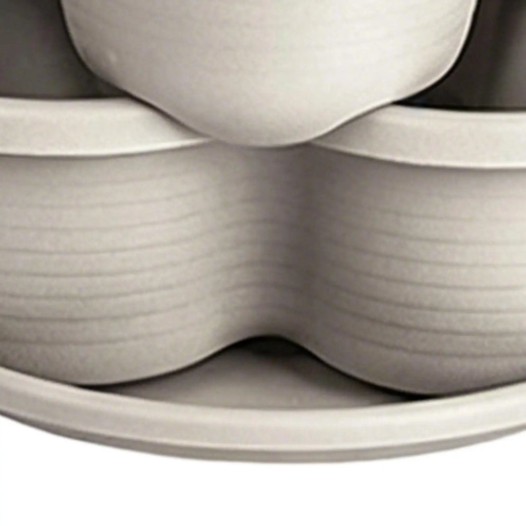 White butterfly-shaped planter pot stack, molded plastic curved cups joined together
