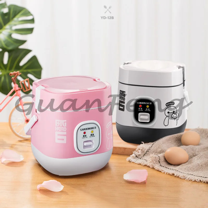 Portable mini rice cooker set in pink and white, compact counter appliance with lid handle