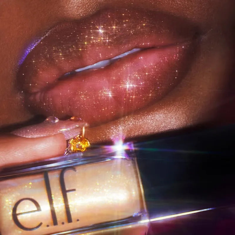 e.l.f. Glow Reviver Lip Oil in gold, showing high-shine, moisturizing glossy texture on lips with glitter finish.