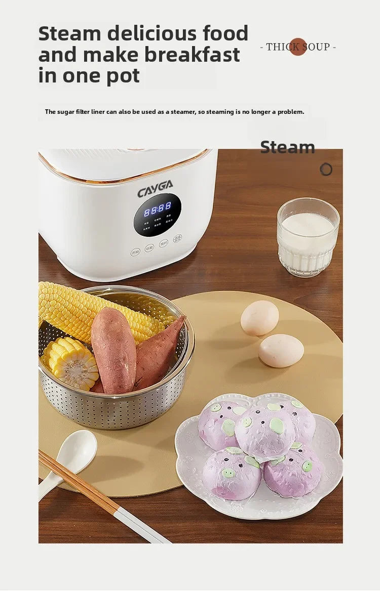 White mini electric cooker with digital display and steaming basket over ingredients