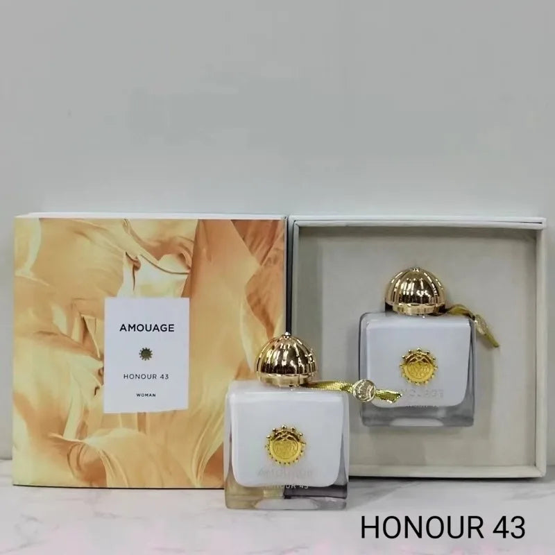 Amouage Honour 43 Woman EDP: Elegant white square bottle, gold cap, luxury feminine fragrance in designer gift box.