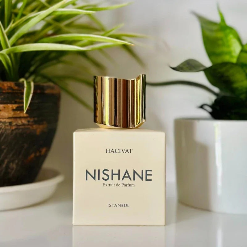 Nishane Hacivat Extrait de Parfum for men. 100ml square bottle with gold cap. Luxury woody chypre fragrance spray.