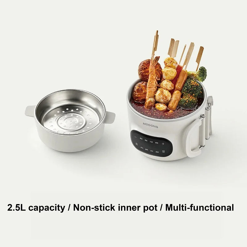 White electric cooking pot with non-stick inner pot and control panel
