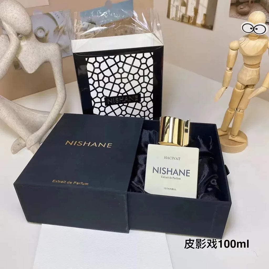 Nishane Hacivat Extrait de Parfum 100ml for men: Elegant square bottle with gold cap in luxury black gift presentation.