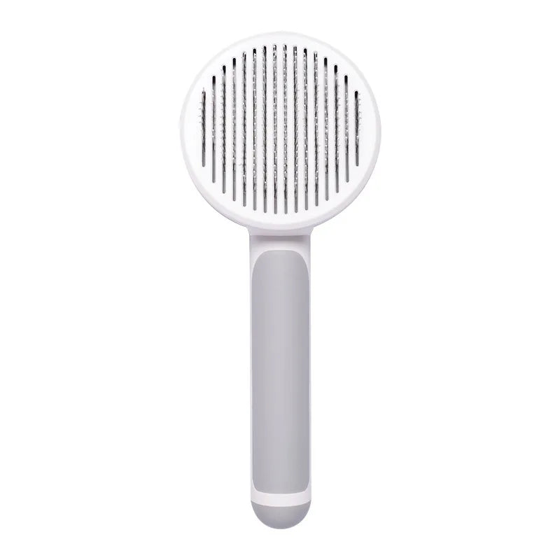 White and grey self-cleaning slicker brush for cats and dogs to remove tangled hair and shedding.