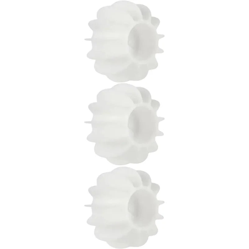 Reusable white silicone laundry balls for removing pet hair and cat fur from clothing in the washing machine.