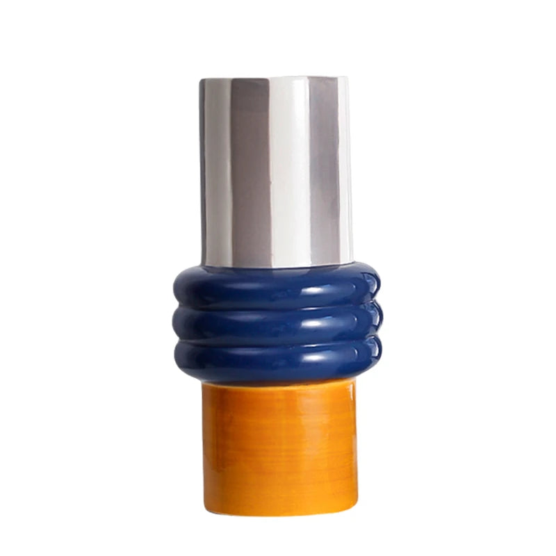 Shiny ceramic vase with silver top, blue ribbed middle, and orange bottom